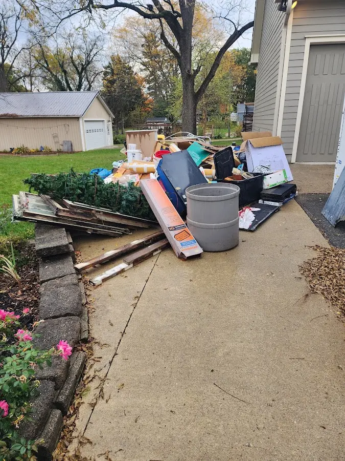 Dumpster being loaded with debris for Roofing Dumpster Rental in Salisbury
